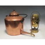 A large 19th century hot water pot with brass spigot and iron bale handle, 55 cm high, and a brass