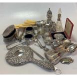 A collection of silver items including condiments, sugar caster, napkin rings, trinket box, hand