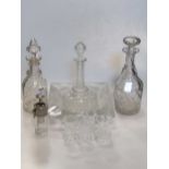 A colleciton of glasswear to include decanters and large cut-glass ashtray