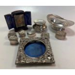 A silver bon bon dish together with a collection of boxes, a cased silver clock and a photograph