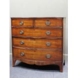 An early 19th century mahogany bowfronted chest of drawers on bracket feet, 103 x 106 x 56cm
