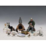 Doulton, Copenhagen and other mostly animal figures, together with a carved and painted wood