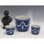 A Wedgwood blue jasperware jardiniere and a pair of cache pots; a Wedgwood black basalt bust of