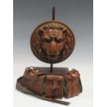 A carved oak lions mask plaque mounted as a lamp base, A wall piece 19th century percussion muzzle