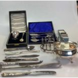 A silver sugar bowl, a silver toast rack, a cased silver egg cup and spoon, some silver flatware (