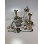 Two silver mustards, two silver topped cut glass pepperettes, a silver topped cut glass sugar