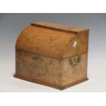 A Victorian walnut stationery box with curved hinged lid