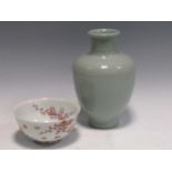 A Celadon glazed vase, 24cm high, and a restored bowl decorated with blossom