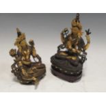 Two Eastern bronze, gilt and painted female figures, 20th Century, larger 22cm high