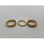 two hallmarked 18ct gold rings, gross weight 9.4g, together with a hallmarked 22ct gold ring 1.9g (