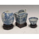 Three blue and white wares including a squat vase, a small bowl and small pouring vesselCondition