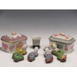 Four Chinese reclining stoneware figures in traditional dress, on wooden stands, a pair of