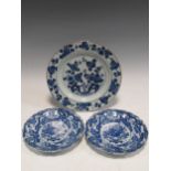A pair of 19th century Japanese blue and white porcelain plates, decorated with dragons; and an 18th