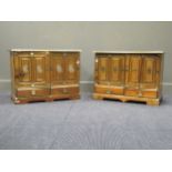 An elm or hardwood and brass bound low cabinet, with two fielded panel doors enclosing an