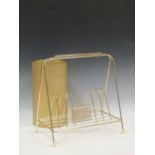 A modern gold coloured weighted umbrella stand together with a bright gold coloured magazine rack (