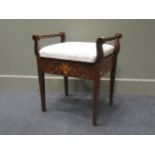 An Edwardian mahogany and inlaid piano stool with hinged upholstered seat and turned side handles on