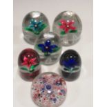 An Old English Millefiori glass paperweight, and 5 other Selkirk weights with lampwork flower