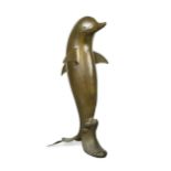 A contemporary bronze model of a dolphin,