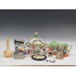 A collection of English and Continental ceramics to include a floral encrusted bowl and cover, a