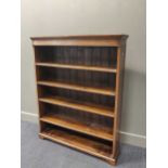 An oak open bookcase, circa 1920s, 110cm wide, 137cm high