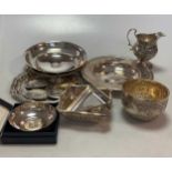 A collection of silverware including an Armada dish, two waiters, two pierced bon-bon dishes, a