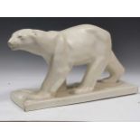 A French Orchies pottery model of a polar bear marked to underside Orchies, 62cm long, damaged.