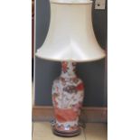 A Chinese style ceramic lamp with shade