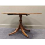 A yew wood reproduction oval breakfast table 74 x 137 x 99cm