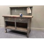 An early 20th century estate made heavy green painted pine work bench 145.5 x 152 x 62cm together