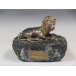 A silver '925' marked model lion of Judah, mounted on a marble base, by Yaacov Heller