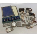 A collection of silver and silver plated boxes (a/f), together with a silver rattle, an open faced