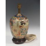 Oriental ceramic lamp decorated with woman in traditional garb and gilt borders