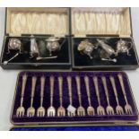 Two cased silver three-piece condiment sets, a cased set of 12 oyster forks and a collection of