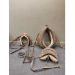 A collection of horse related equipment to include hames, straps, yoke etcProvenance: Landwade Hall,