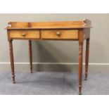 A 19th century oak washstand, the shaped three-quarter gallery above two frieze drawers raised on