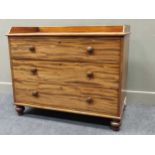 A 19th century mahogany chest of drawers stamped "Edwards & Roberts", the three quarter raised