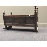 A late 17th / early 18th century carved oak cradle, 60 x 99 x 57cm