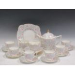 Mintons Petunia pattern tea set, to include teapot, cups and saucers and milk jug