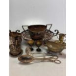 A collection of silver plated ware including a tea set, bowls, flatware, bottle holder etc