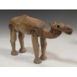 A carved wood dromedary camel Provenance: The studio of Michael Stennett Condition report: 23.5 tall