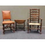 An oak Carolean style leather seated dining chair, and oak and elm ladder back chair and a small oak