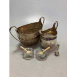 A silver milk jug and sugar bowl, 15.9ozt gross, together with a pair of glass salts stamped