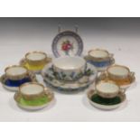 Seven Vienna cups and saucers, the different coloured ground bodies beneath gilt rims; a Meissen
