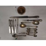 A collection of silverware included some case flatware, a bottle coaster and a number of glass