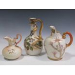 A Royal Worcester jug, with a lizard handle, 23cm high; a Royal Worcester flat sided jug, 19cm high;