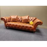 A leather upholstered Chesterfield settee