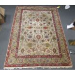 A Persian design rug with ivory ground and main beige border, 310 x 218cm