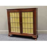 A mahogany two door side cabinet with leaded glazed doors, 108.5 x 122 x 36cm