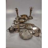 A collection of silverware including condiments, ashtrays, a milk jug, a quaich, a pepper mill, a