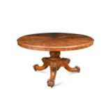 A carved walnut circular breakfast table, 19th century,